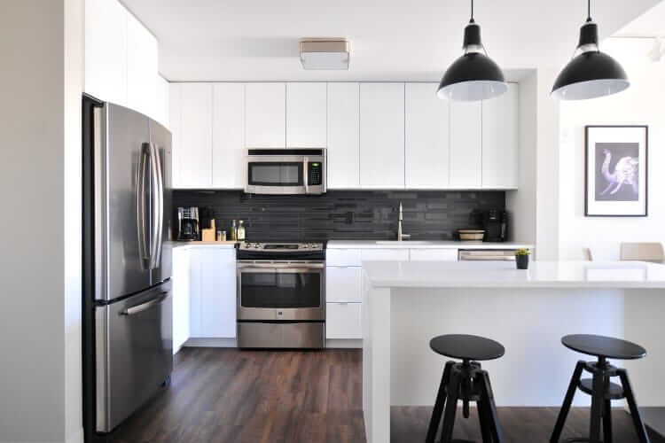 L-Shaped Kitchen - white and black colour scheme