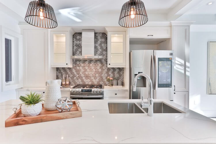 White kitchen with patterned splashback
